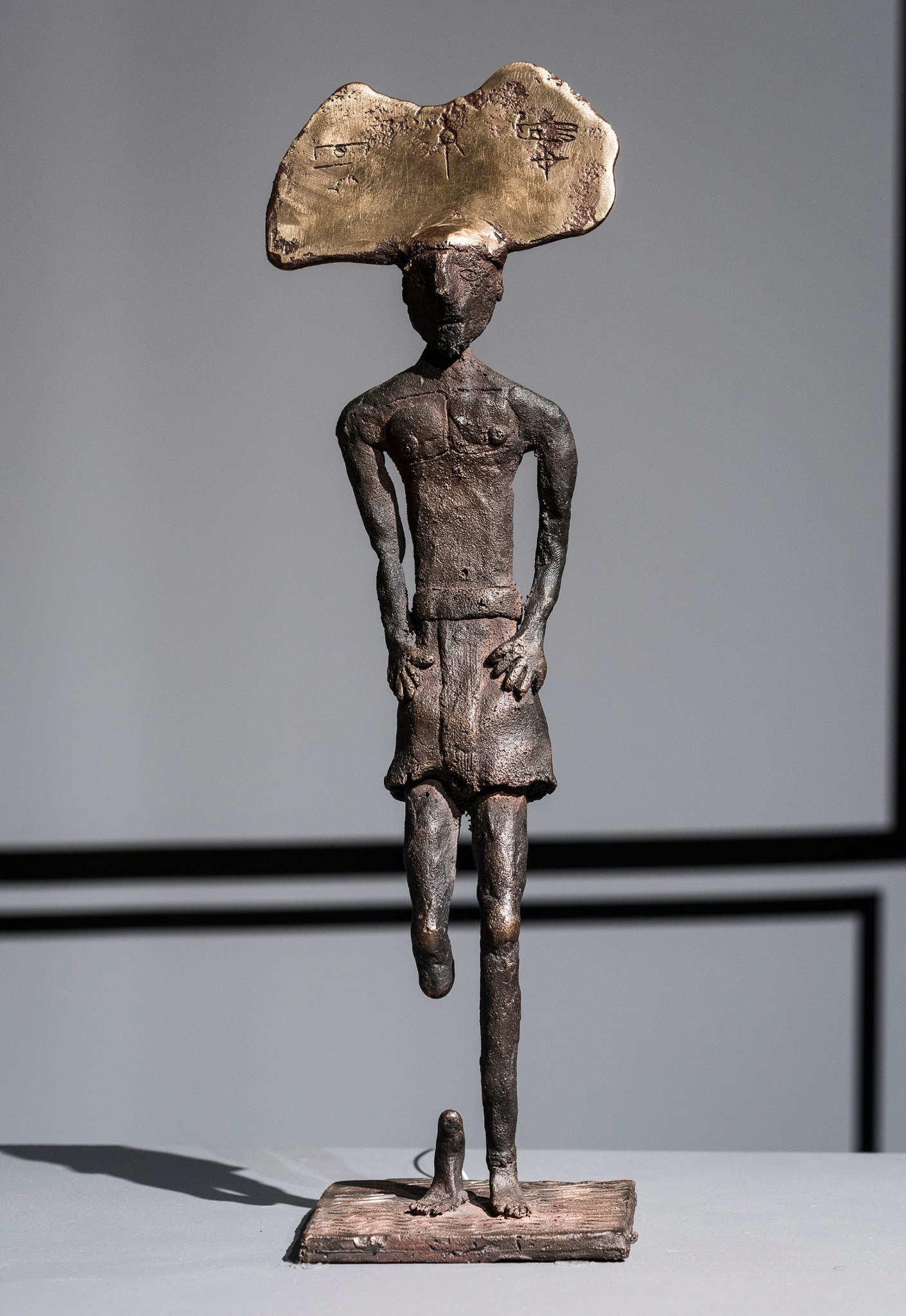 Standing bronze figure from Acculturation Machine